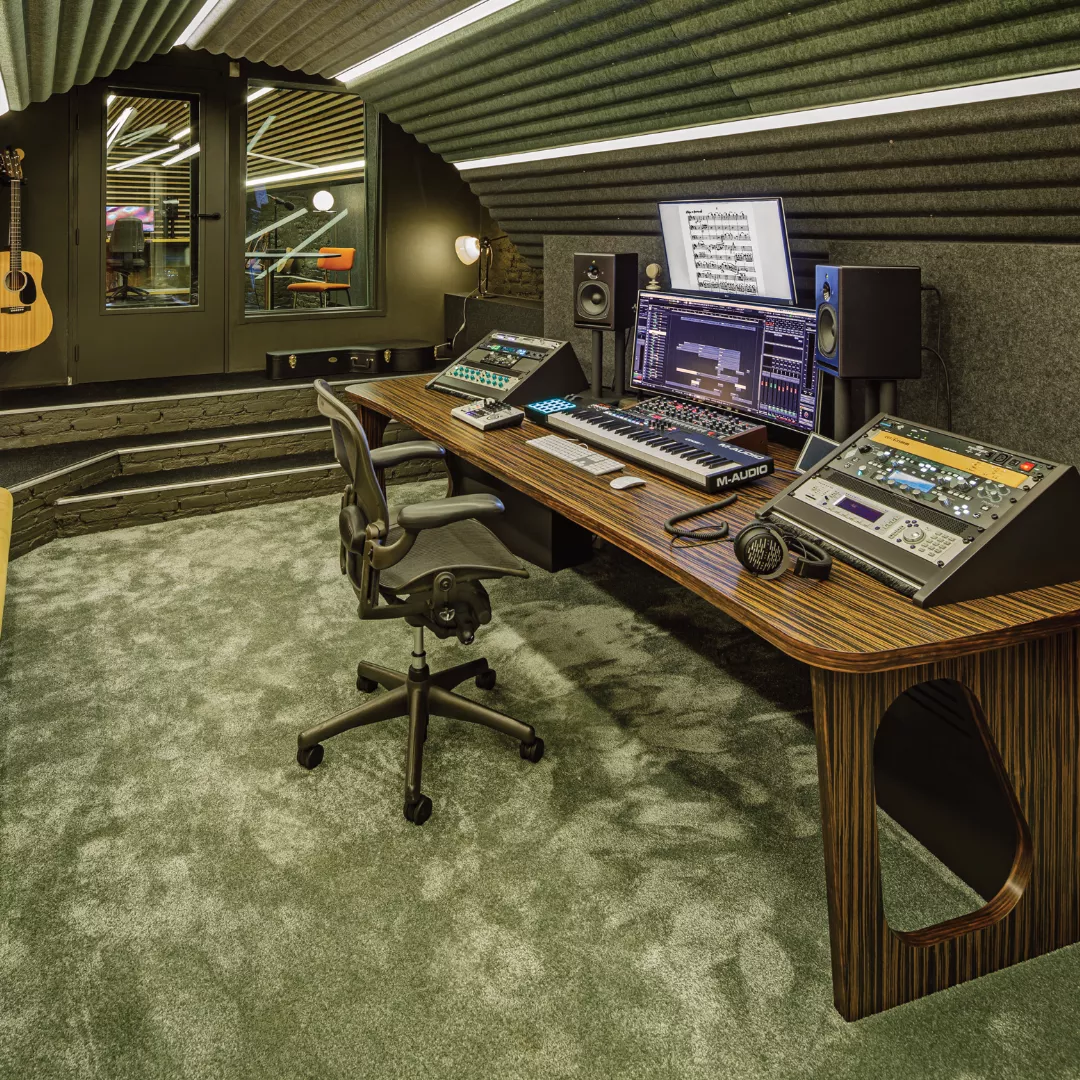 Studio with PSI Audio A17-M monitors, keyboard and mixing equipment